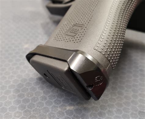 Glock 48 magwell - Guide your loaded magazine smoothly and quickly into the Glock pistol’s grip with the sleek Glock 43x/48 Magwell from Tyrant Designs. Made of 6061 aluminum, and sporting a patent-pending design for the method of attachment, these carefully designed magwells make it so easy that with just a little practice you can load a fresh magazine without ever looking at …